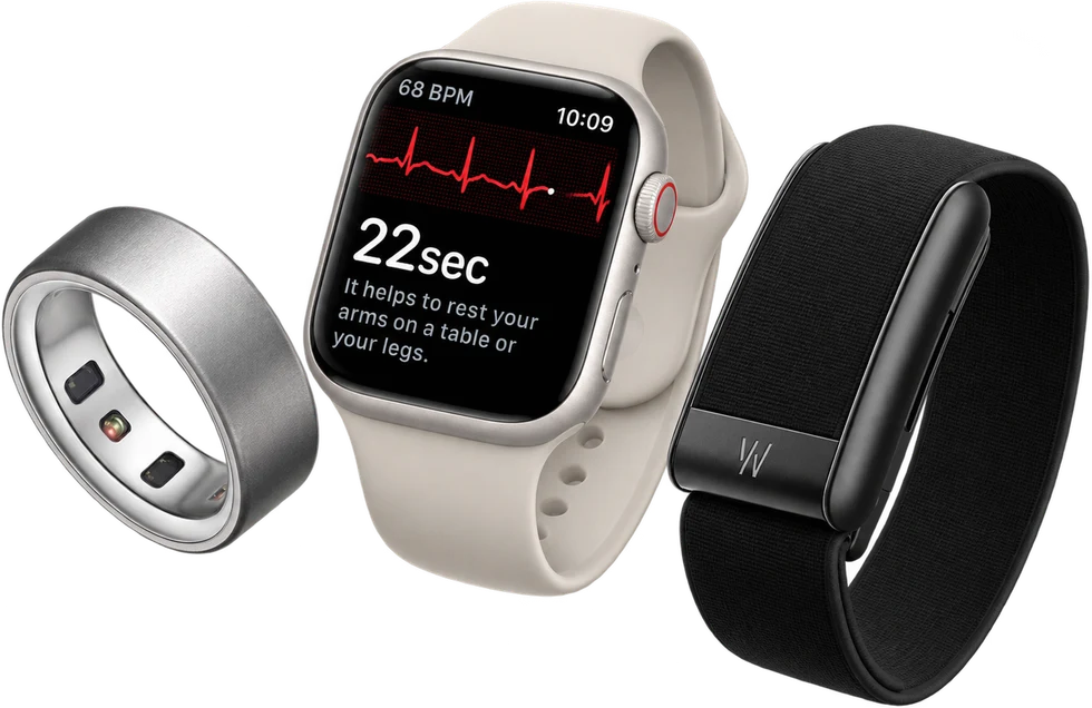 A smart ring, a smart watch showing a heart-rhythm reading, and a fitness band.